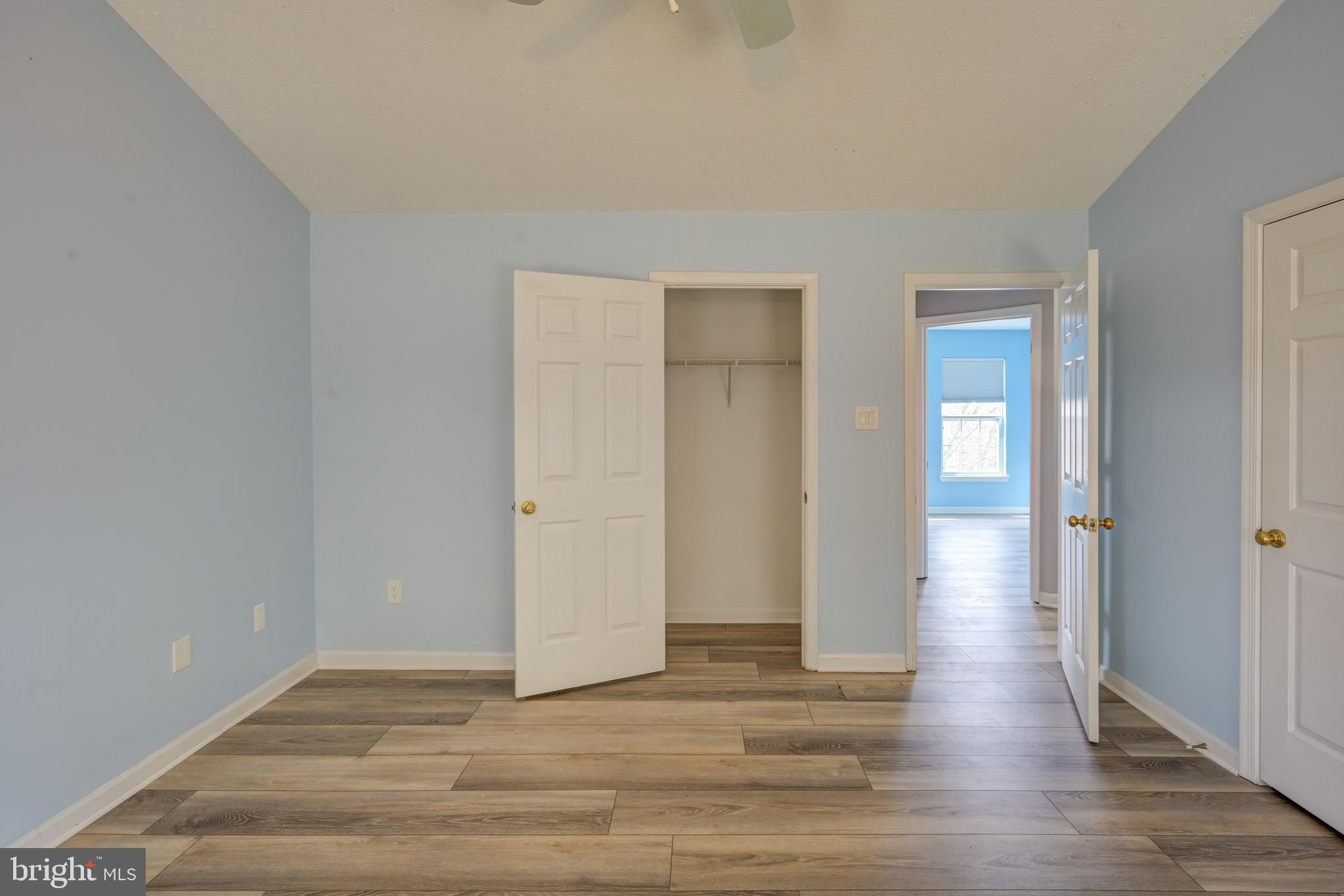 6495 Wesley Lane Elkridge, MD 21075 - Photo 13 of 37 a view of an empty room with wooden floor