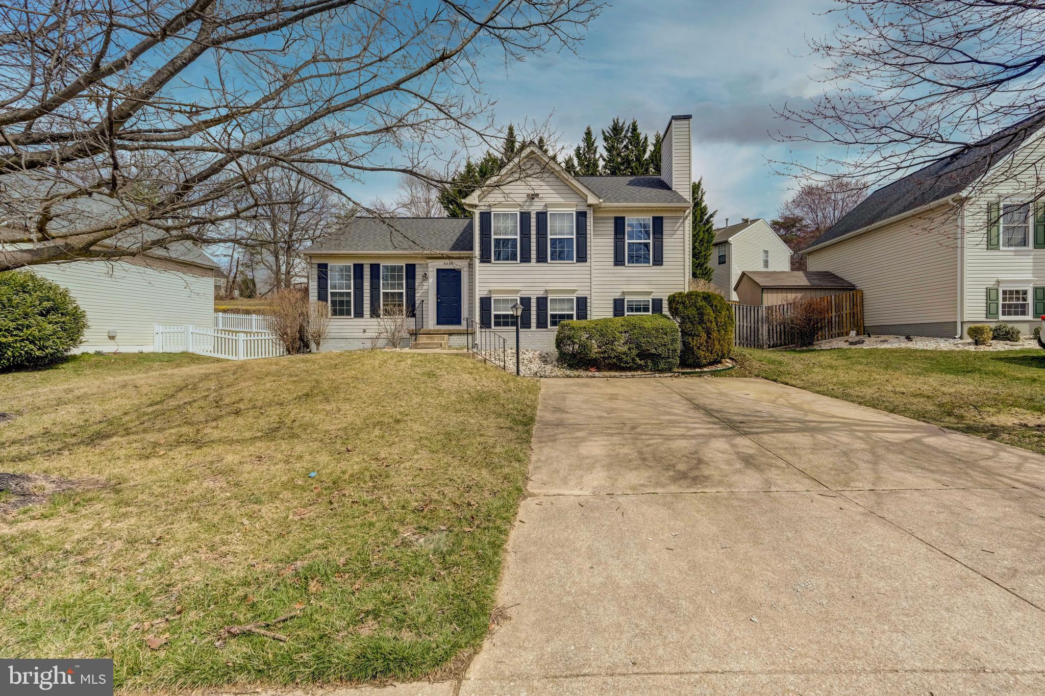 6495 Wesley Lane Elkridge, MD 21075 - Photo 2 of 37 a front view of a house with a yard