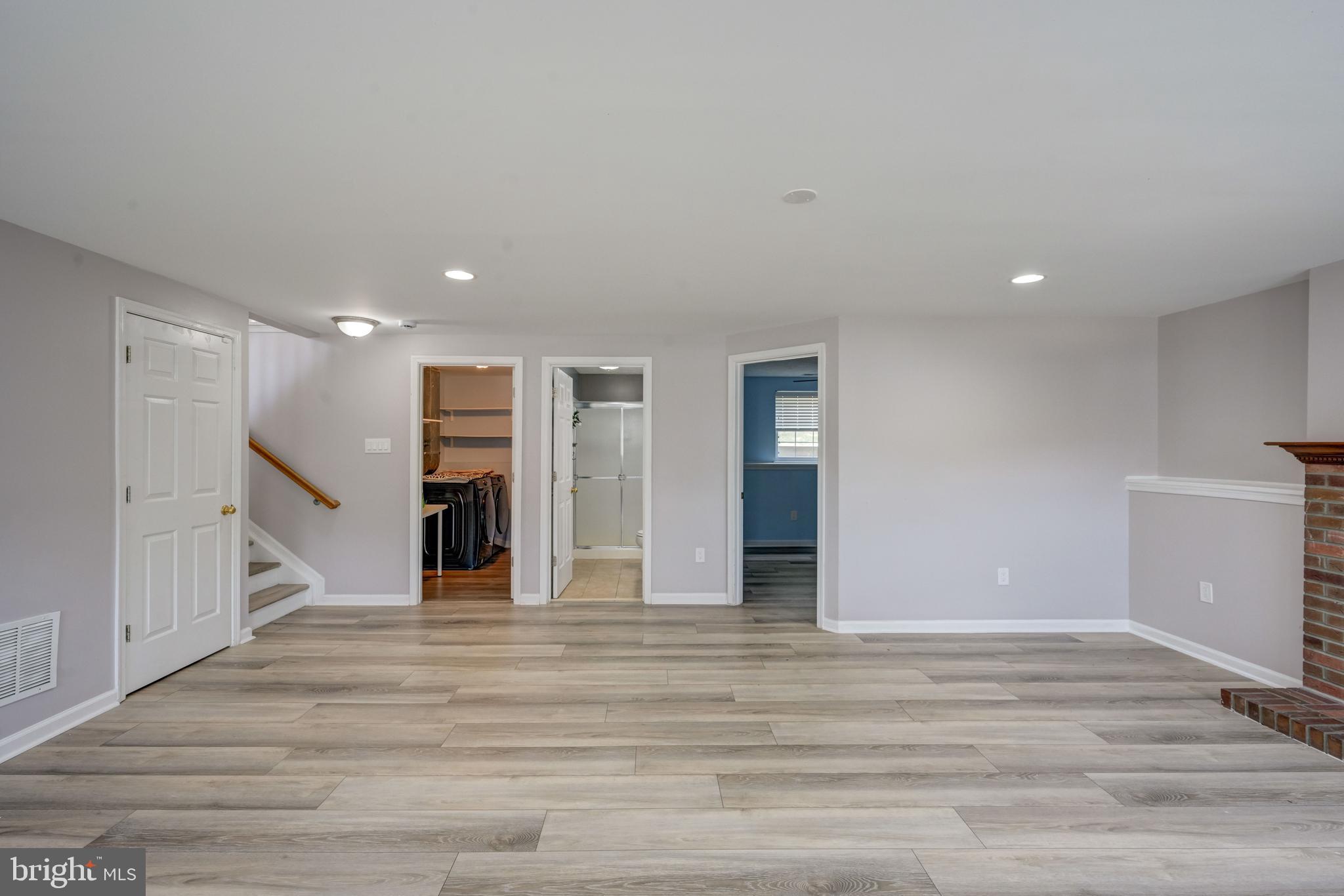 6495 Wesley Lane Elkridge, MD 21075 - Photo 24 of 37 a view of an empty room with wooden floor