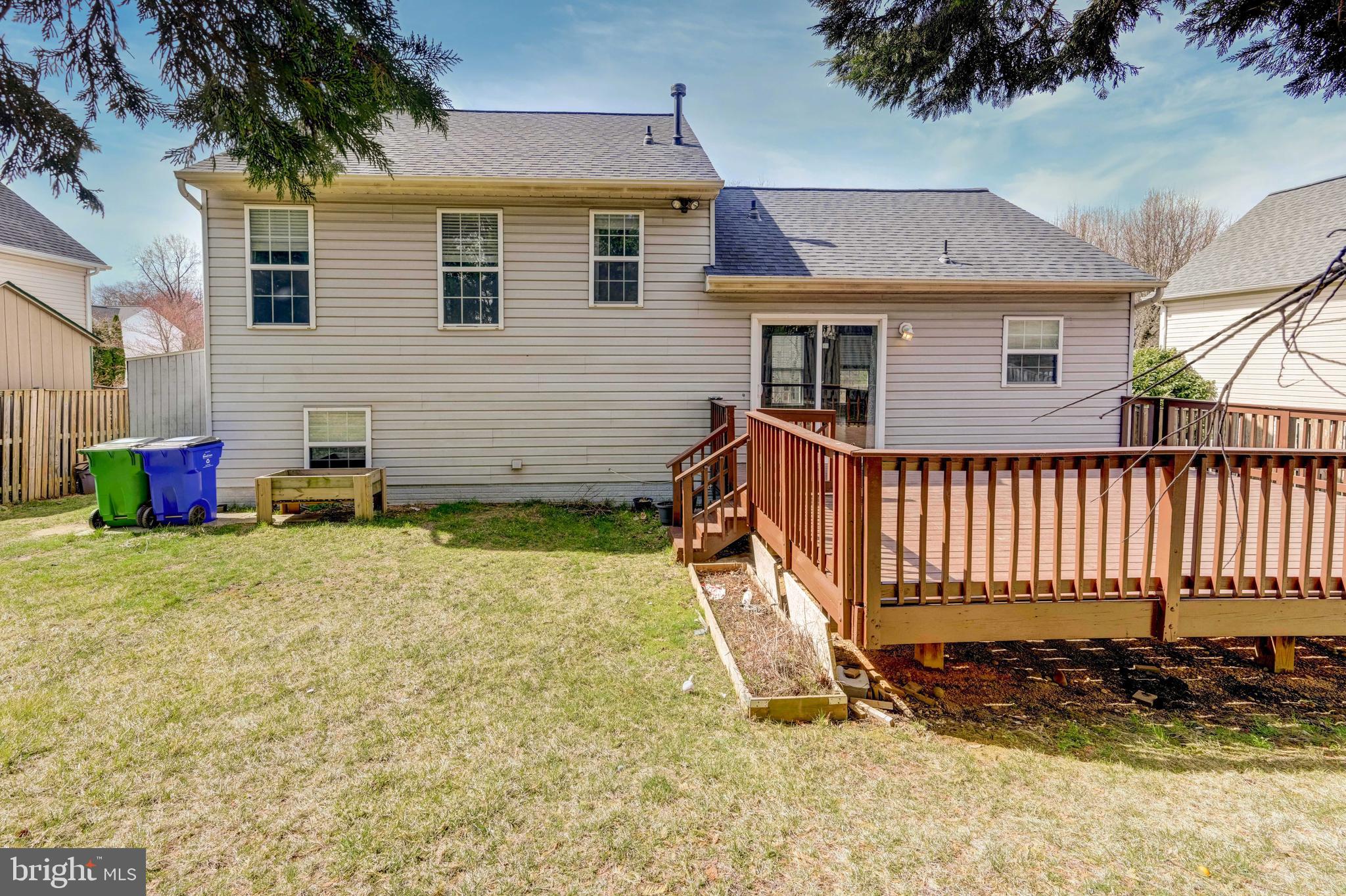 6495 Wesley Lane Elkridge, MD 21075 - Photo 35 of 37 a view of a house with a yard