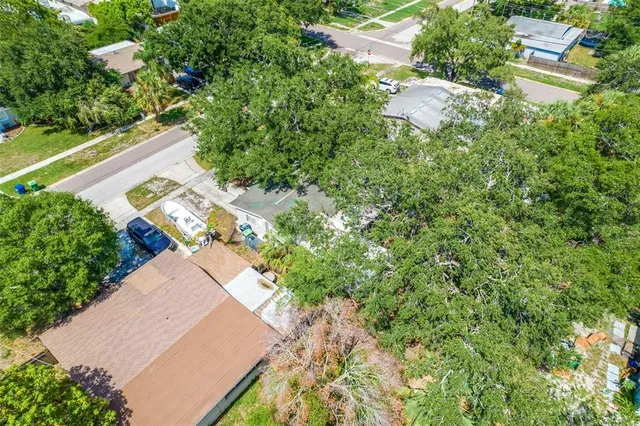 a kitchen with stainless steel appliances granite countertop a refrigerator a stove and a sink