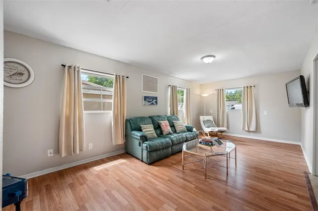 a bedroom with a bed and a ceiling fan