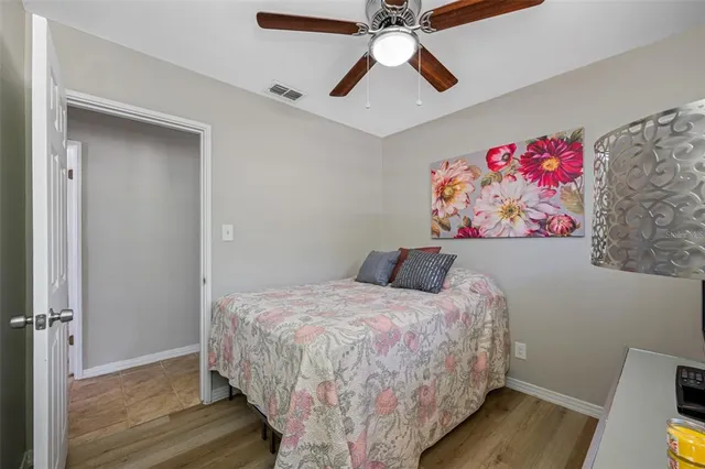 a view of a livingroom with wooden floor and chair