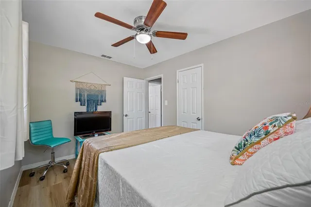 a view of a house with a tree in a yard