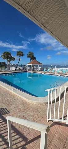 a view of a house with a wooden deck