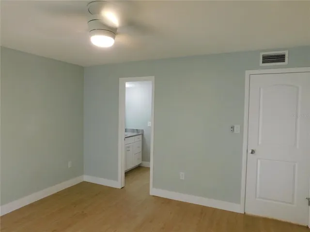 a view of a room with a hallway