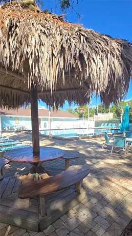 a view of a swimming pool with a yard