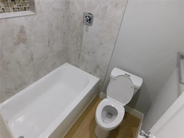 a bathroom with a toilet and a sink