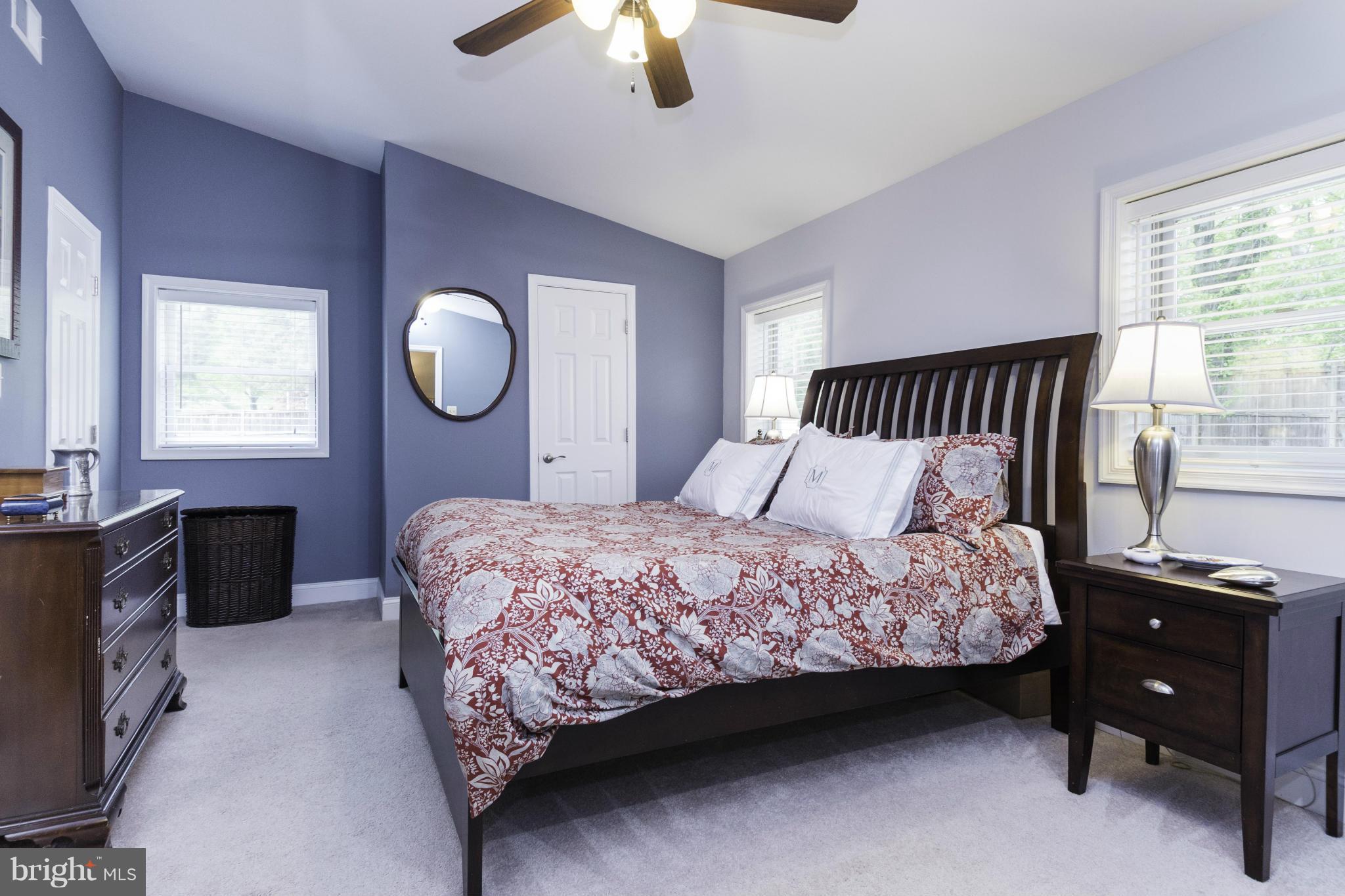 6600 Pine Road Alexandria, VA 22312 - Photo 11 of 28 a bedroom with a bed and a chandelier