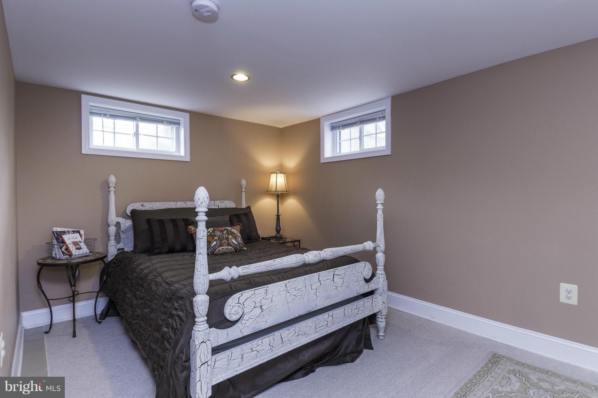 6600 Pine Road Alexandria, VA 22312 - Photo 19 of 28 a bedroom with bed and window