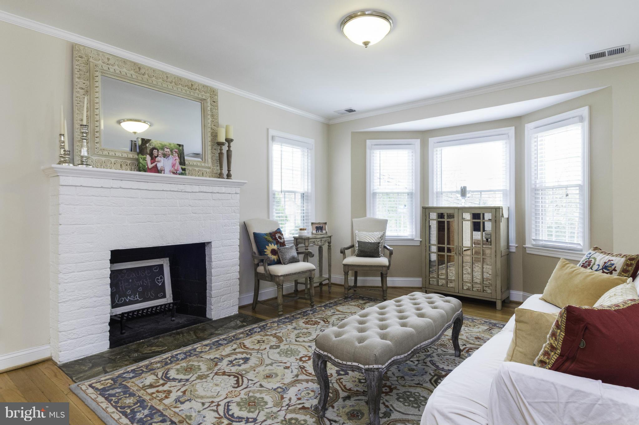 6600 Pine Road Alexandria, VA 22312 - Photo 3 of 28 a living room with furniture and a fireplace