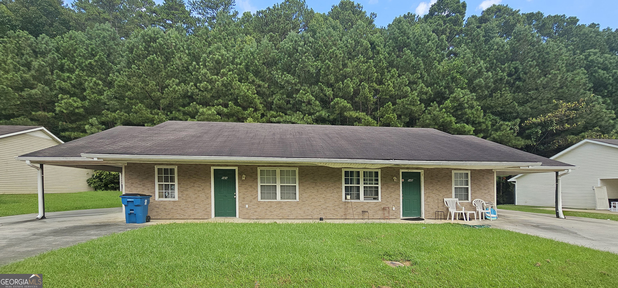 94 Dodd Boulevard Southeast Rome, GA 30161 - Photo 1 of 1 a front view of a house with a garden and porch
