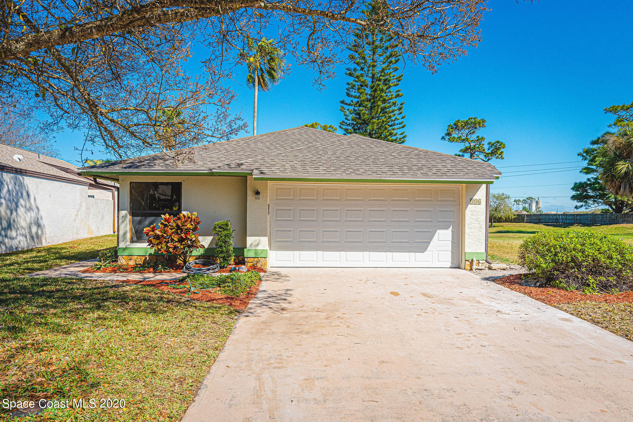 336 Myrtlewood Road Melbourne, FL 32940 - Photo 1 of 72 a front view of a house with a yard