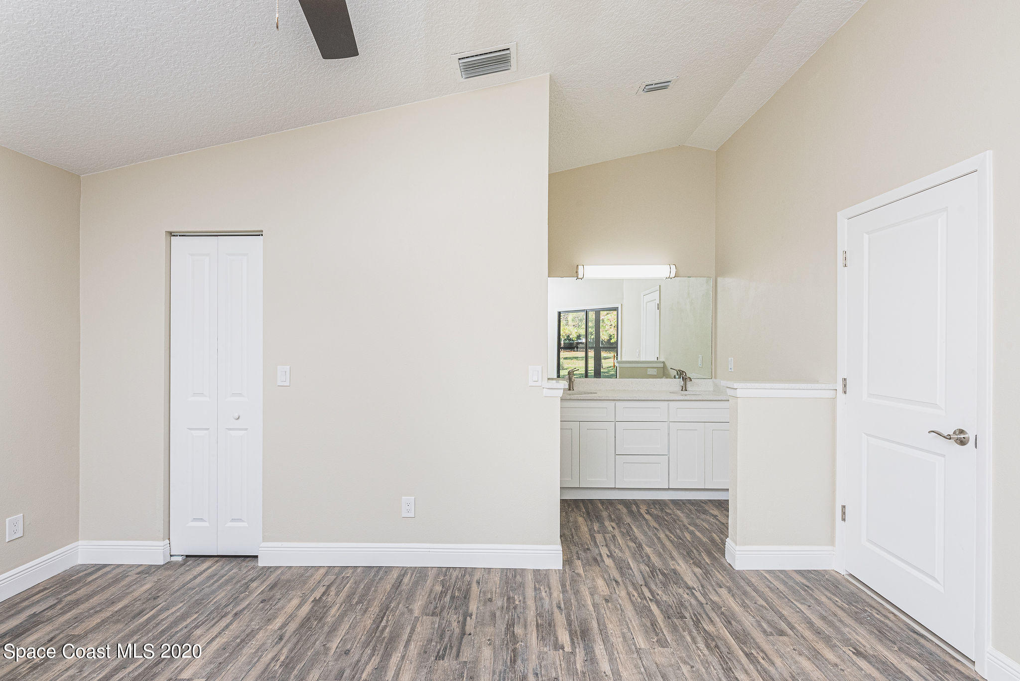 336 Myrtlewood Road Melbourne, FL 32940 - Photo 33 of 72 a room view with wooden floor and bathroom