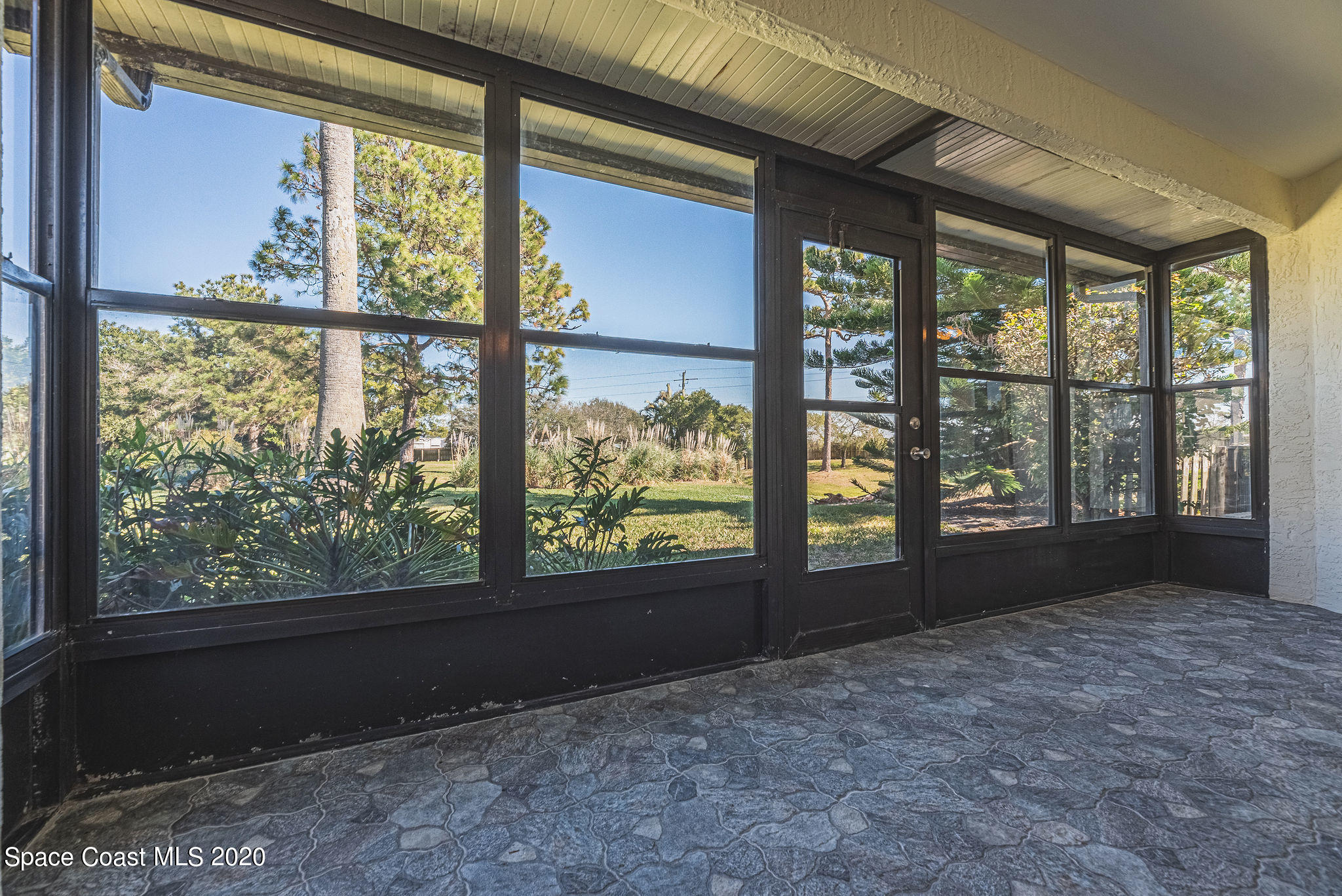 336 Myrtlewood Road Melbourne, FL 32940 - Photo 54 of 72 a view of an empty room with a large window