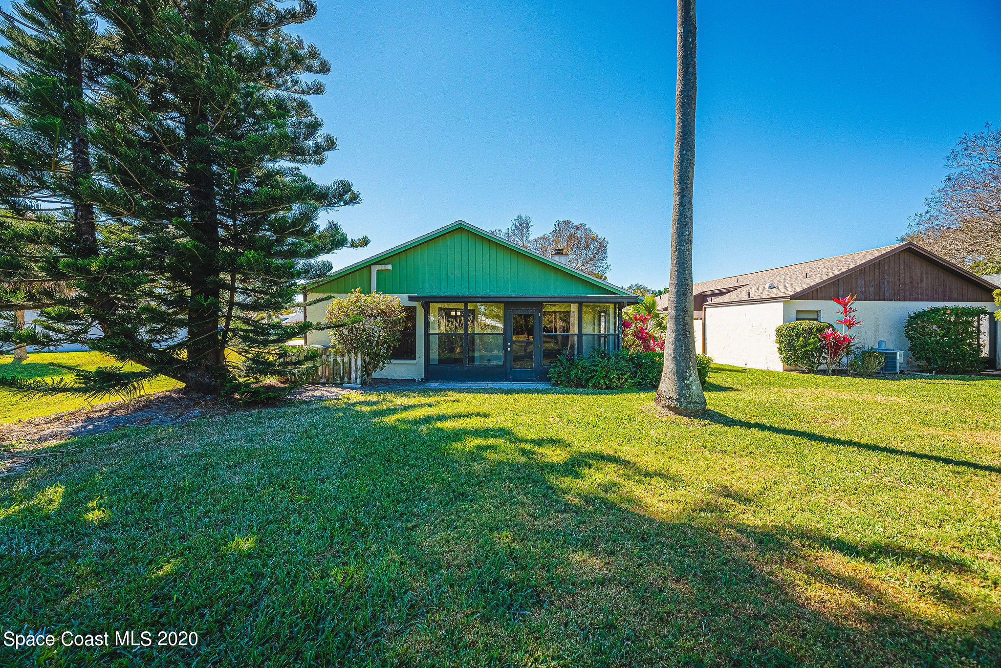 336 Myrtlewood Road Melbourne, FL 32940 - Photo 60 of 72 a view of a house with swimming pool and yard