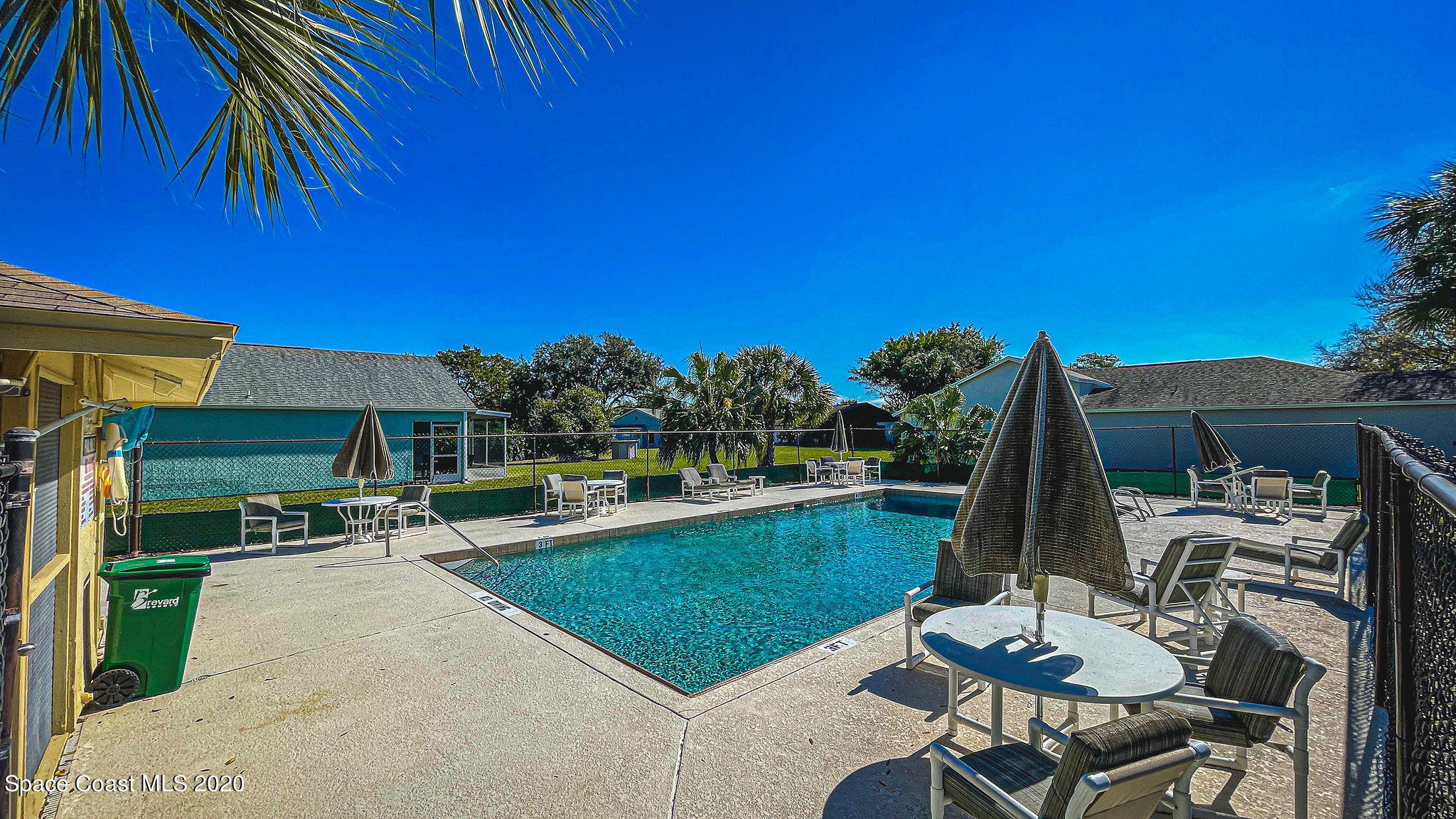 336 Myrtlewood Road Melbourne, FL 32940 - Photo 62 of 72 a view of a chairs and table in patio