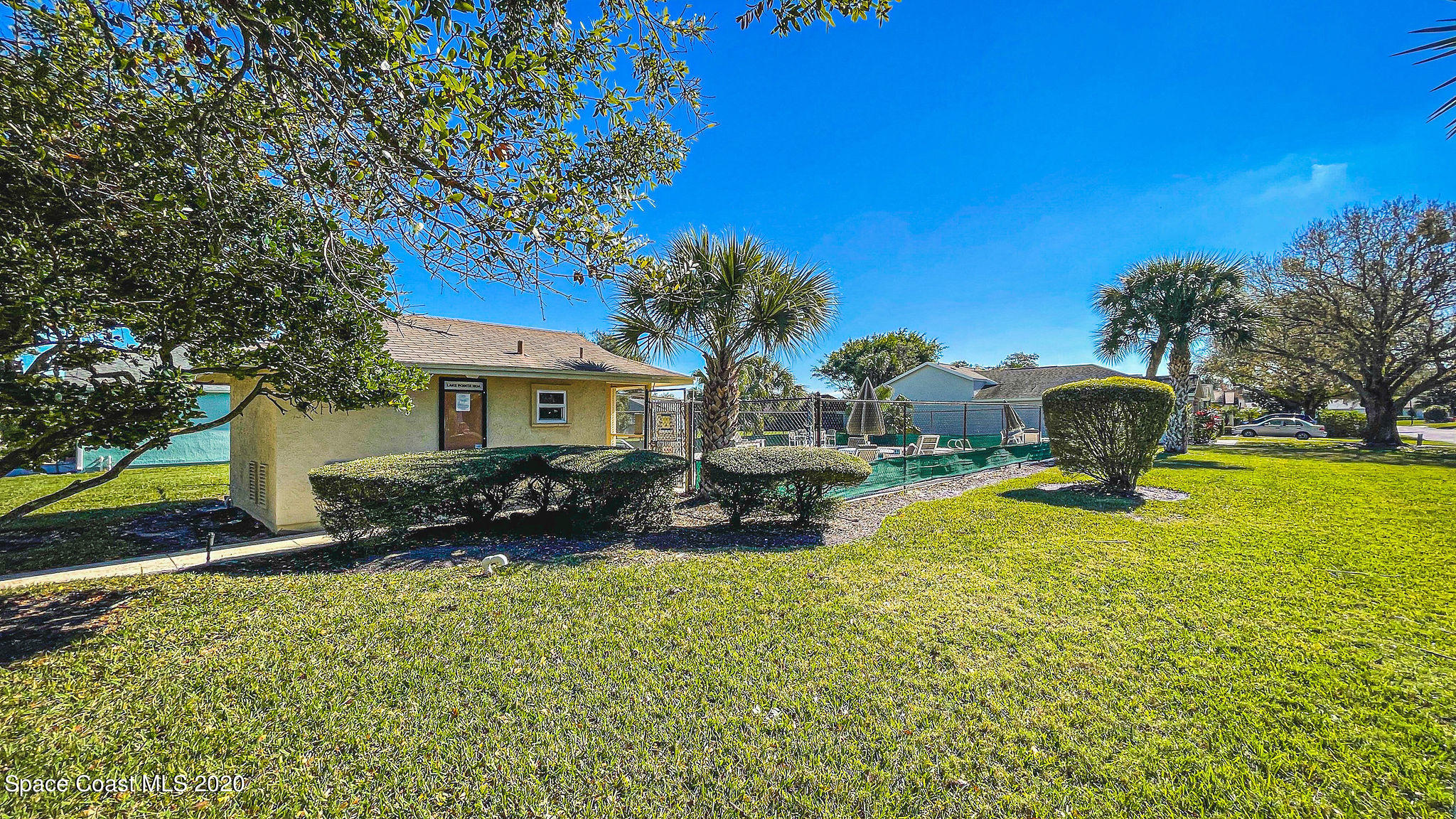 336 Myrtlewood Road Melbourne, FL 32940 - Photo 66 of 72 a front view of a house with garden and patio