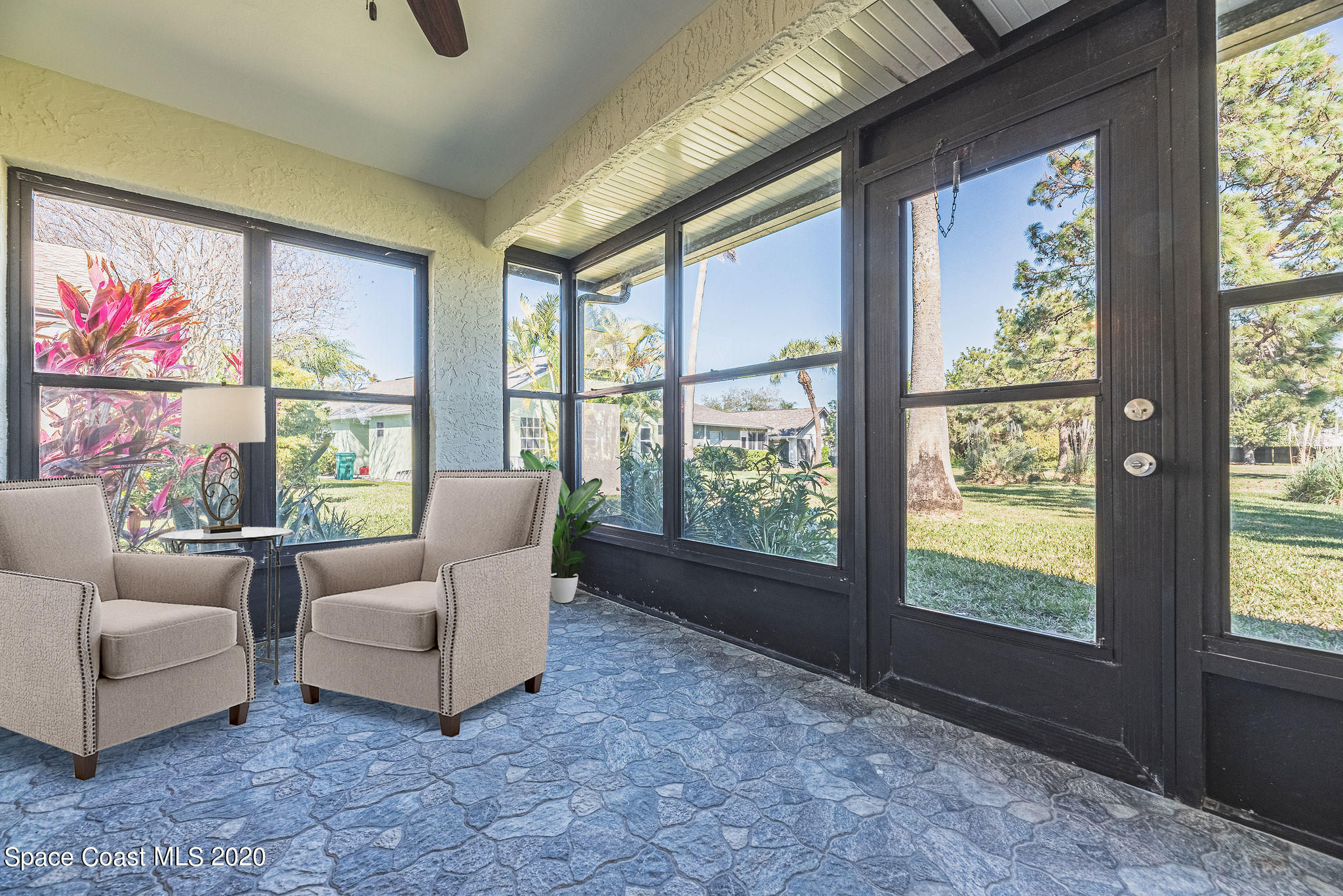 336 Myrtlewood Road Melbourne, FL 32940 - Photo 68 of 72 a living room with furniture and a large window
