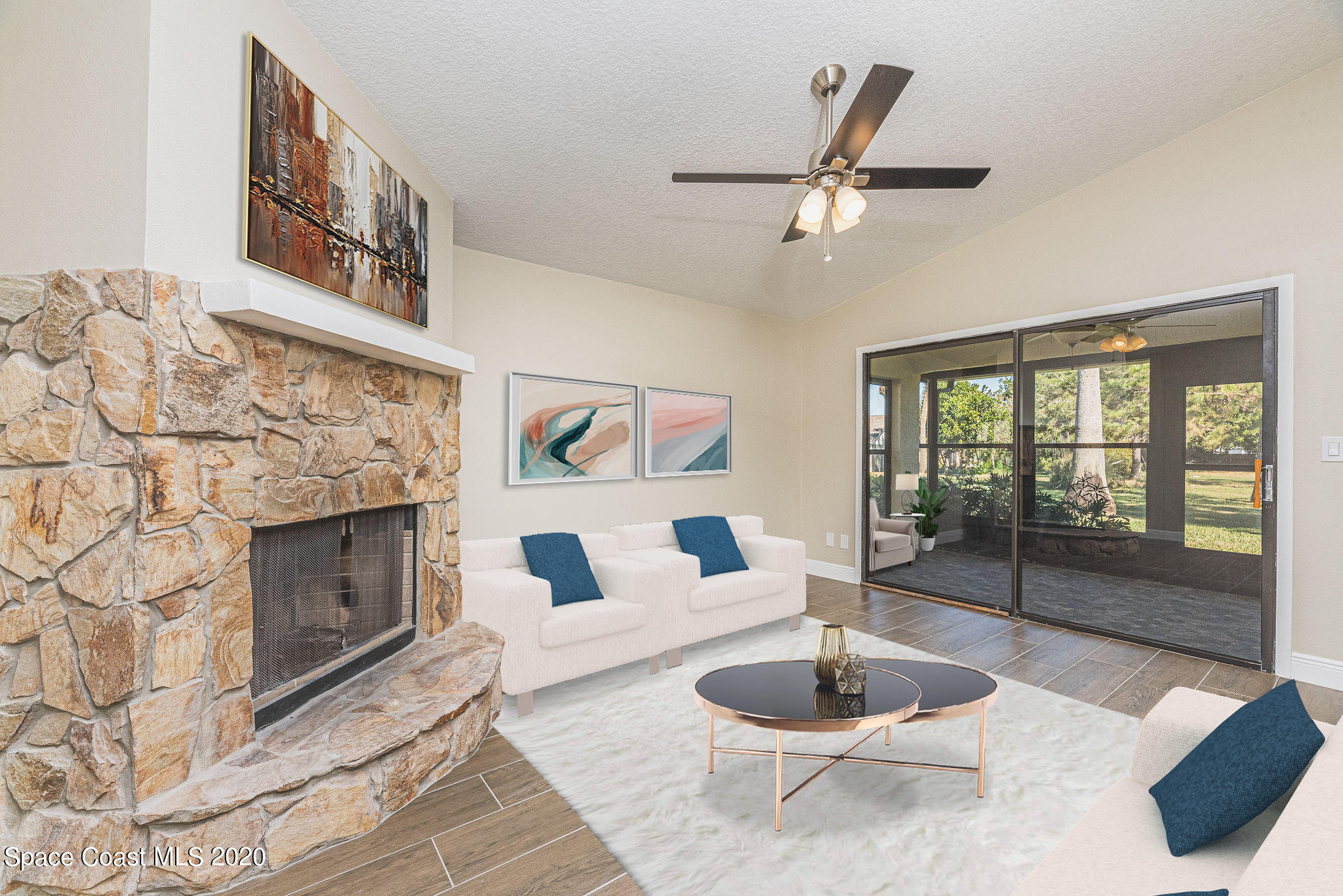 336 Myrtlewood Road Melbourne, FL 32940 - Photo 8 of 72 a living room with furniture a fireplace and a large window
