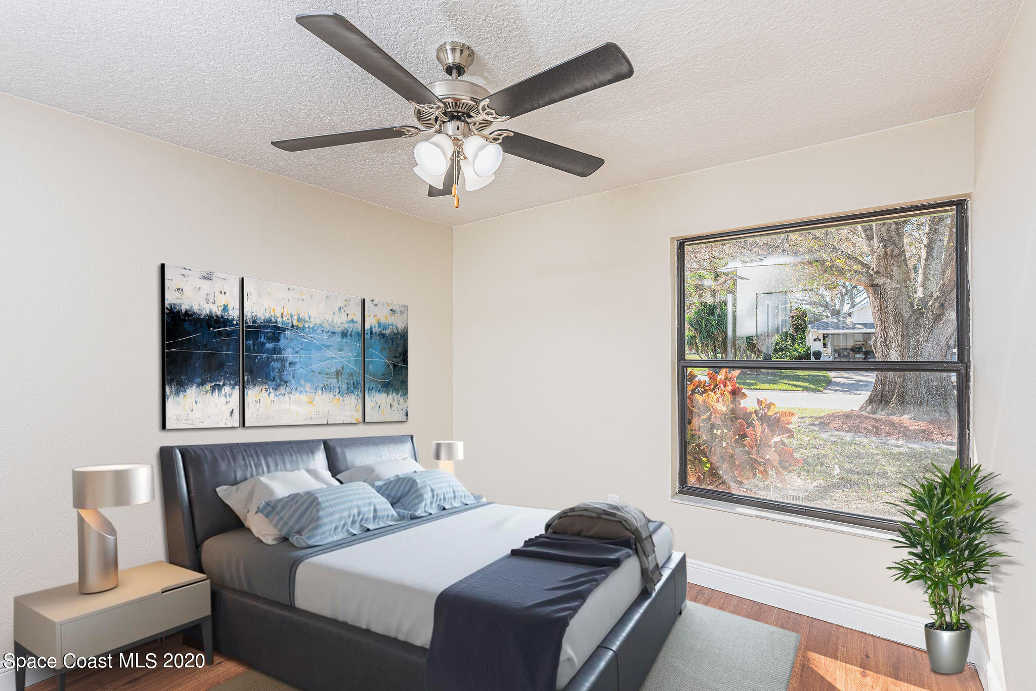 336 Myrtlewood Road Melbourne, FL 32940 - Photo 72 of 72 a bedroom with a large bed and a window