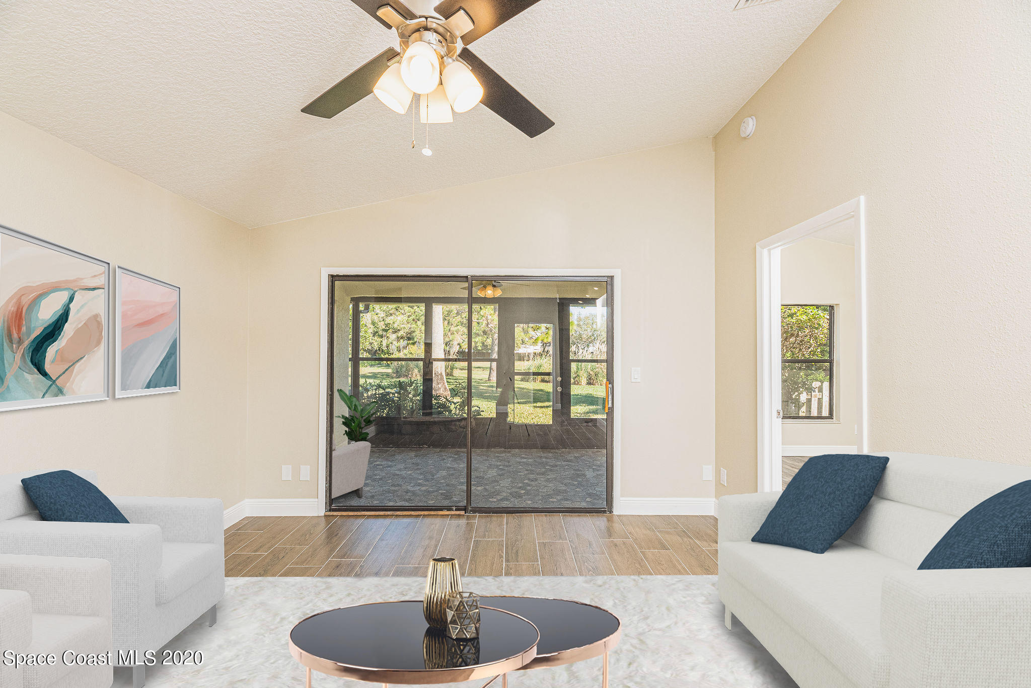 336 Myrtlewood Road Melbourne, FL 32940 - Photo 10 of 72 a living room with furniture and a large window