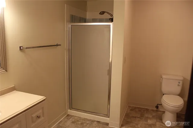 hallway with wooden floor and mirror