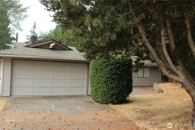a kitchen with a sink stove and microwave