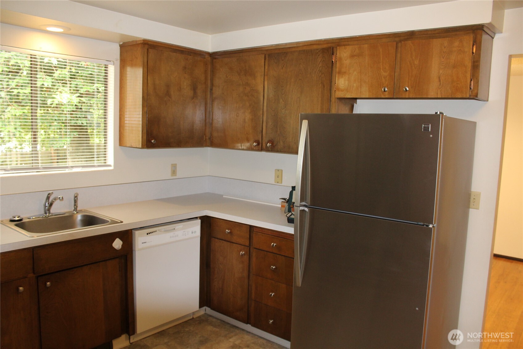 419 156th Place Northeast Bellevue, WA 98008 - Photo 4 of 22 a kitchen with a refrigerator and a sink