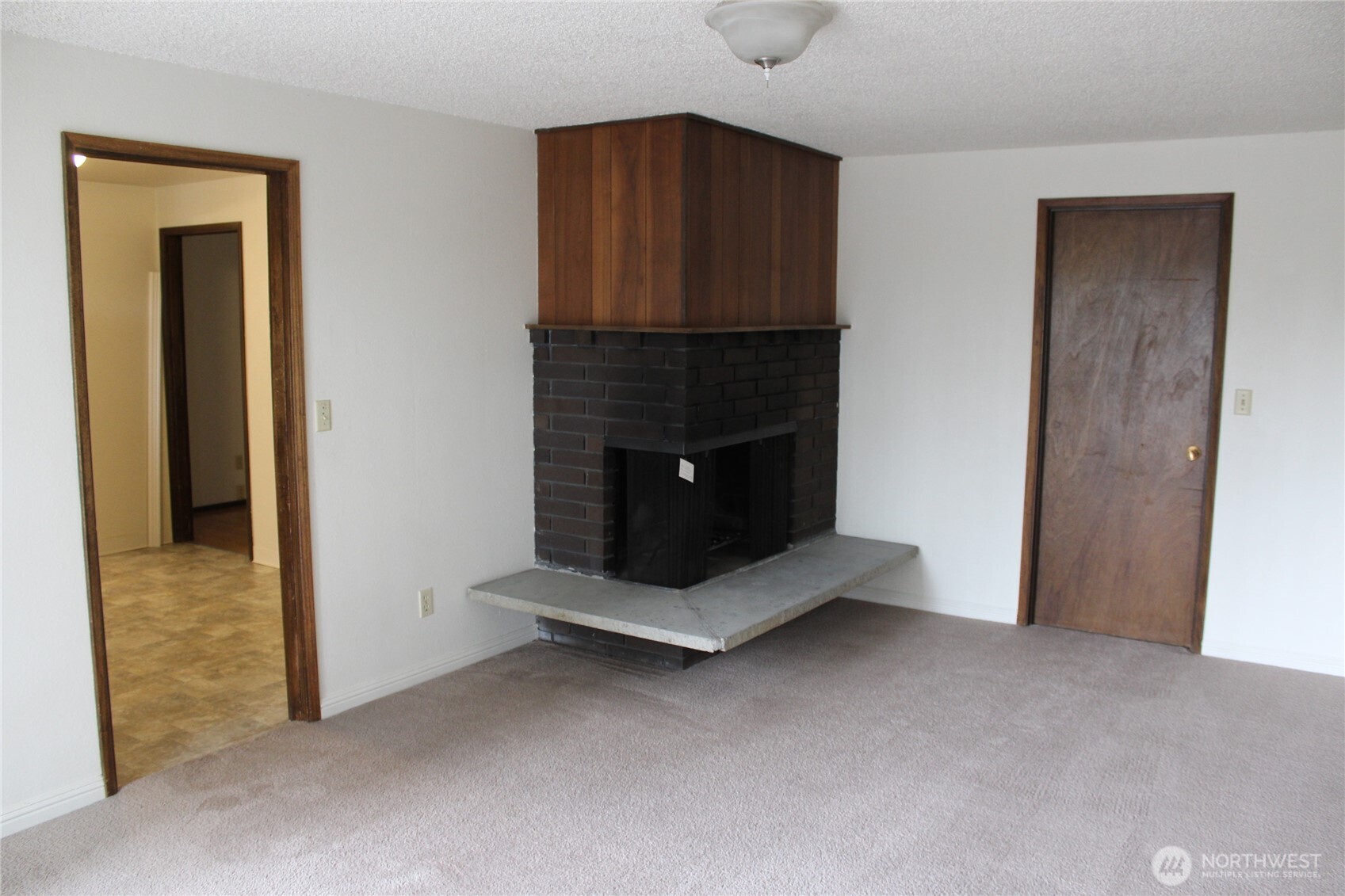 419 156th Place Northeast Bellevue, WA 98008 - Photo 8 of 22 a living room with furniture and a fireplace