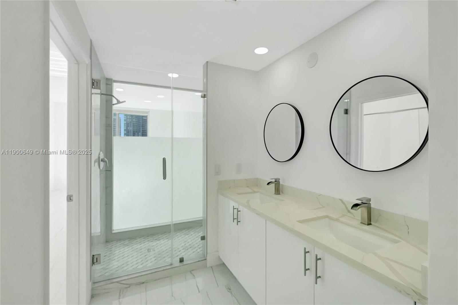 90 Southwest 3rd Street, Unit 1602 Miami, FL 33130 - Photo 19 of 81 a bathroom with a granite countertop sink a mirror and a shower