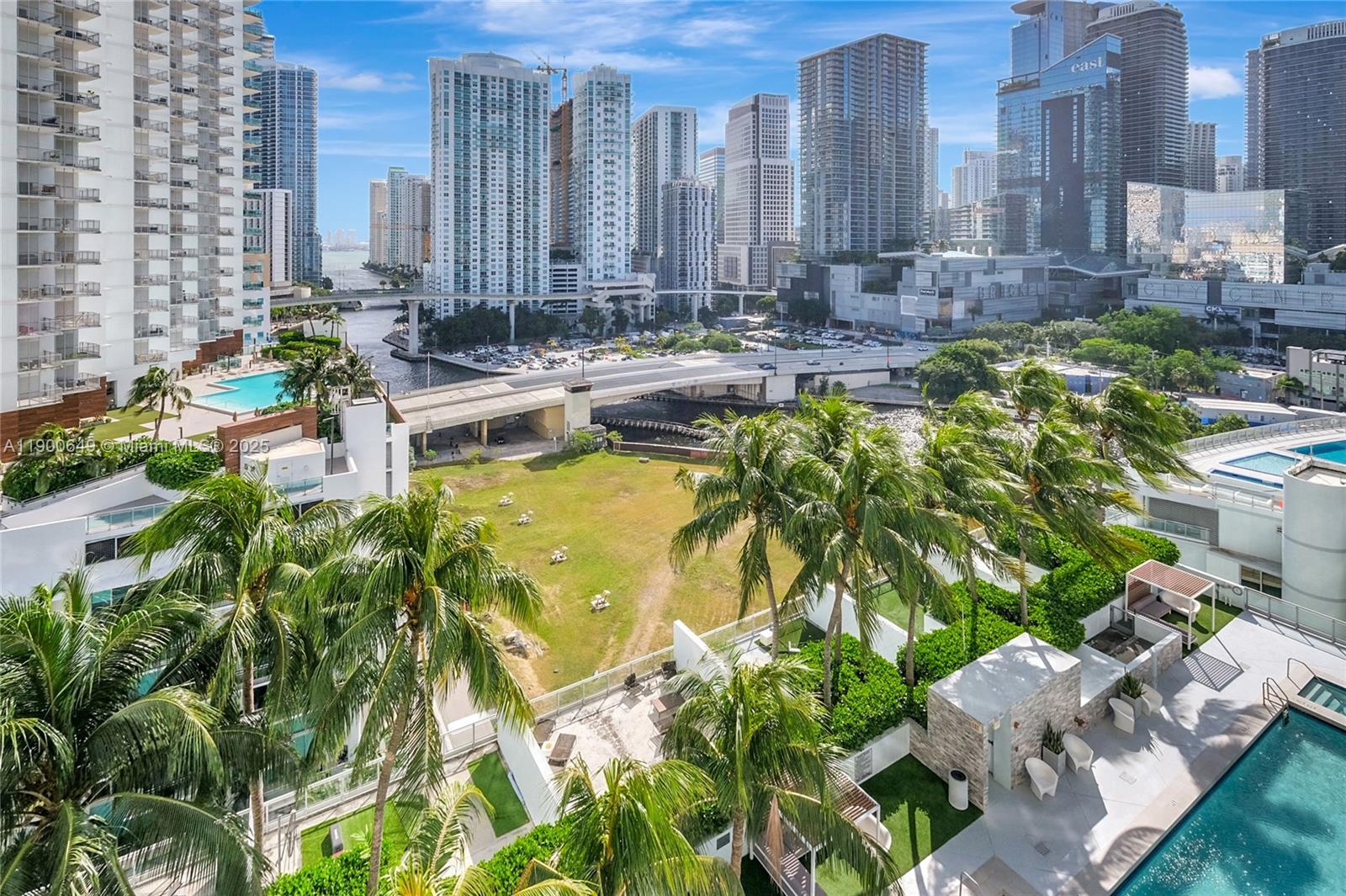90 Southwest 3rd Street, Unit 1602 Miami, FL 33130 - Photo 32 of 81 a view of a swimming pool with chairs and plants