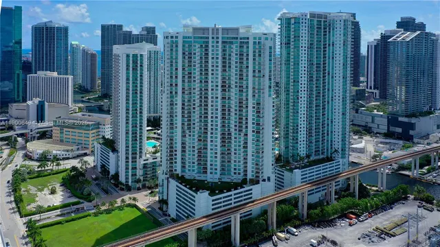 a large white kitchen with a large window