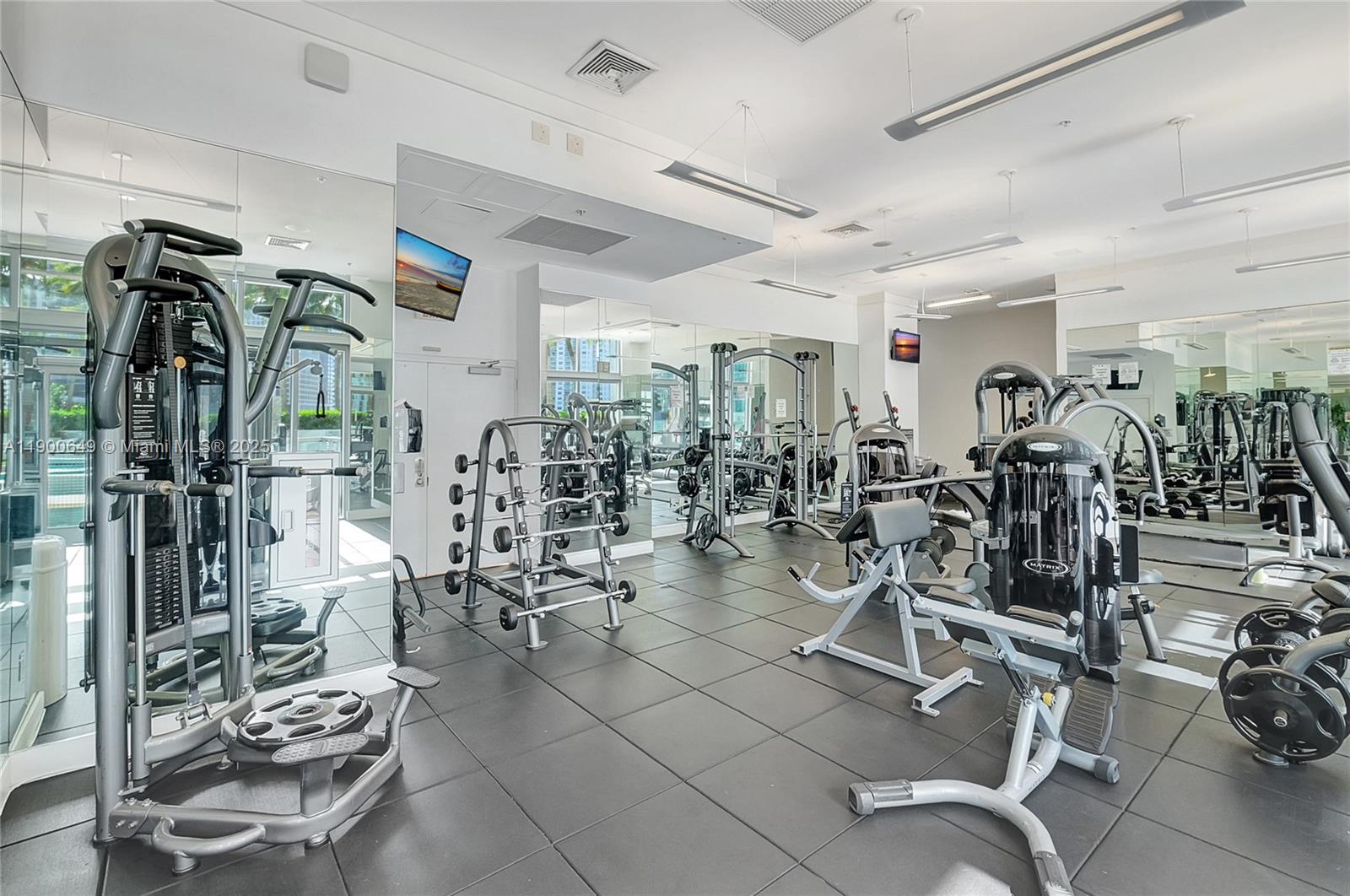 90 Southwest 3rd Street, Unit 1602 Miami, FL 33130 - Photo 57 of 81 a view of a room with gym equipment