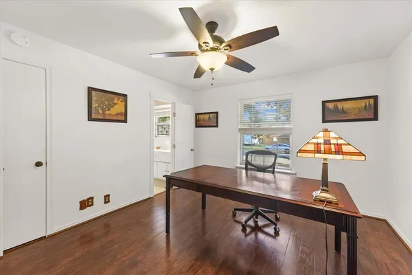 a workspace with furniture and wooden floor