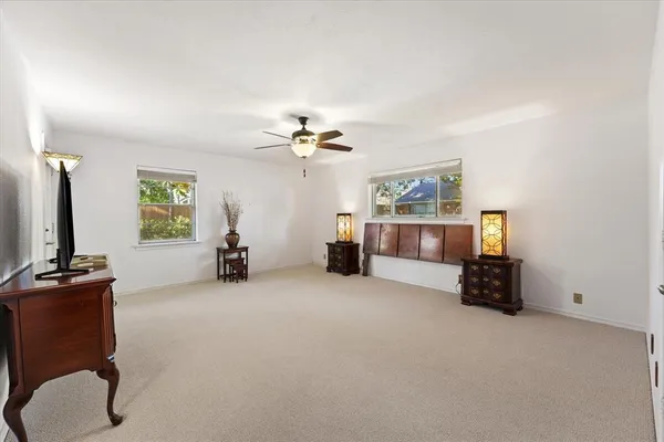 a view of a livingroom with furniture and a flat screen tv
