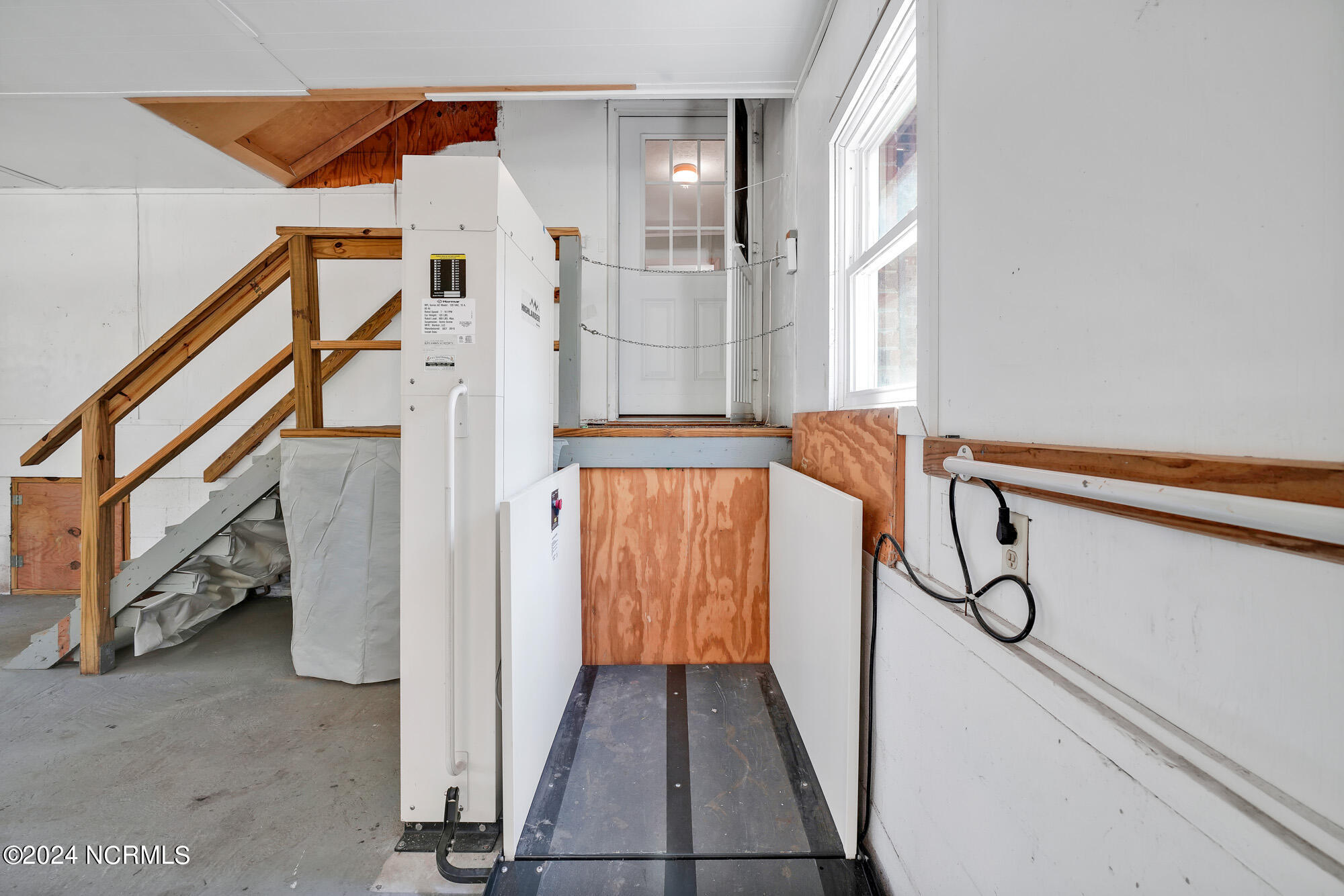83 Maco Road Northeast Leland, NC 28451 - Photo 27 of 39 Wheelchair lift gets you safely and easily into the interior of the home.