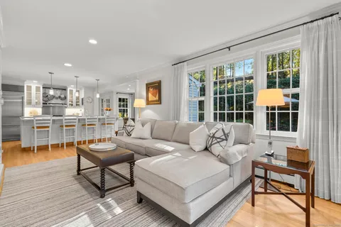 a living room with furniture and a table