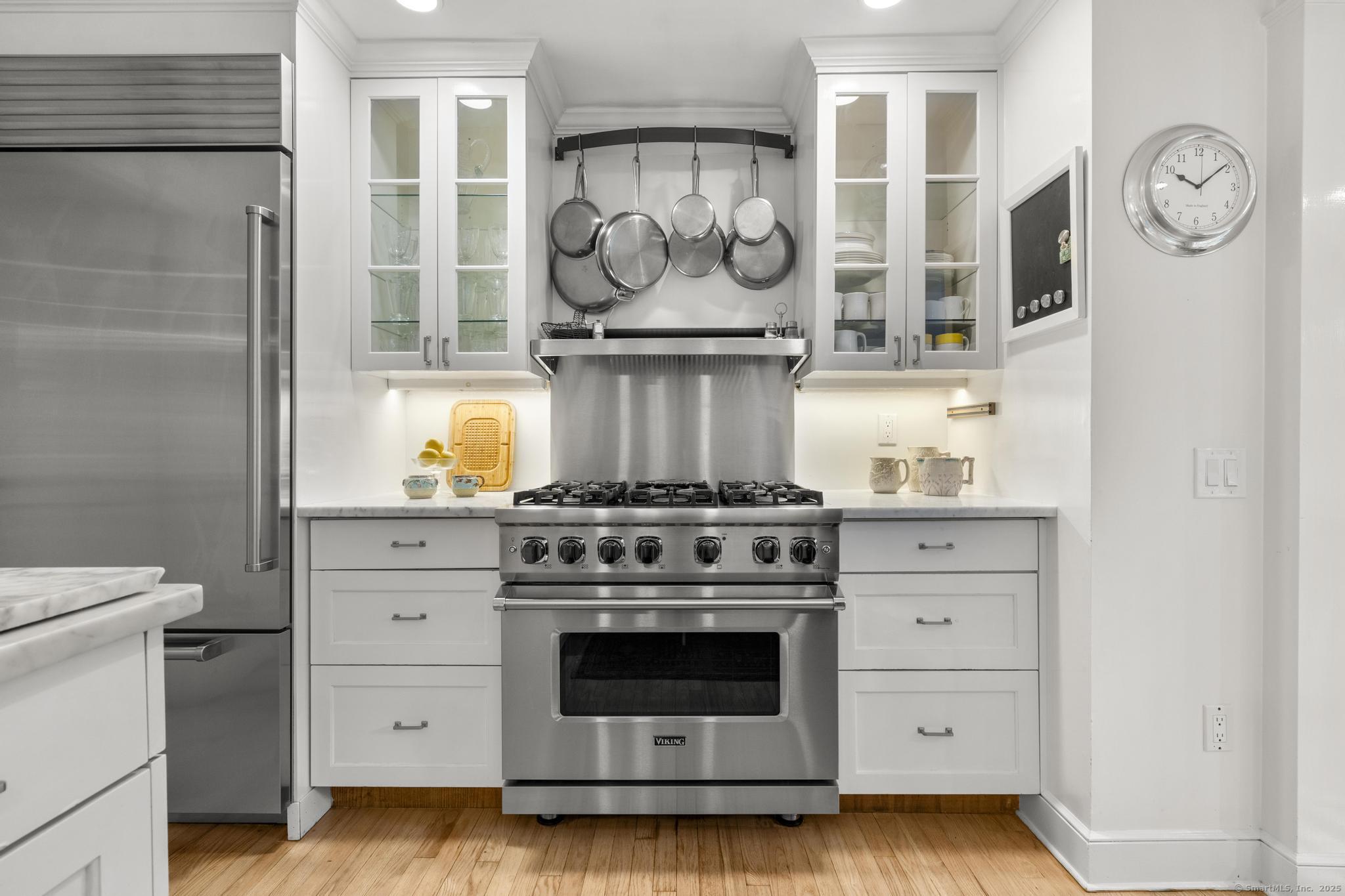 1165 Stillson Road Fairfield, CT 06824 - Photo 18 of 40 a stove top oven sitting inside of a kitchen