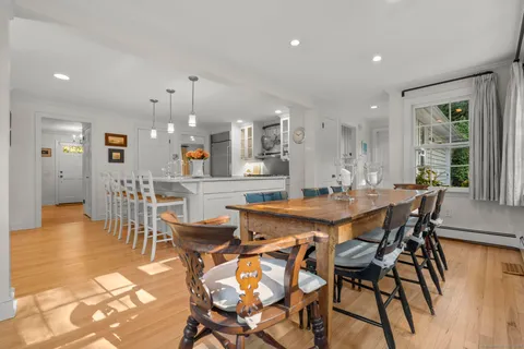 a view of a dining area with furniture and wooden floor
