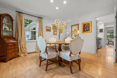 a view of a livingroom with furniture window and wooden floor