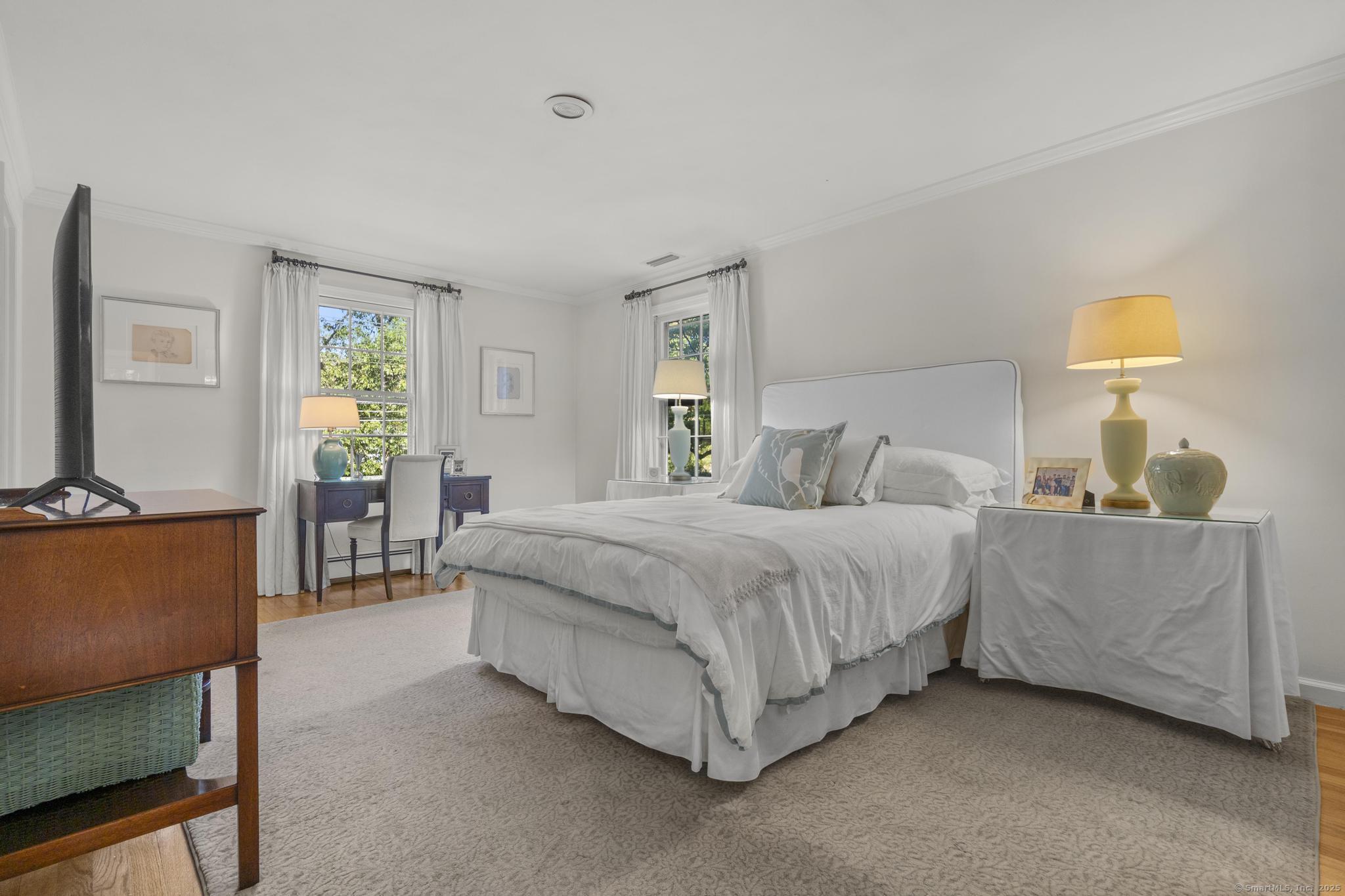 1165 Stillson Road Fairfield, CT 06824 - Photo 24 of 40 a bedroom with a bed and a couch