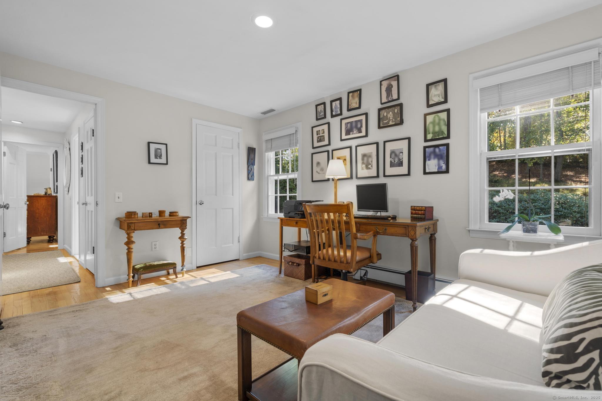 1165 Stillson Road Fairfield, CT 06824 - Photo 31 of 40 a living room with furniture and a window
