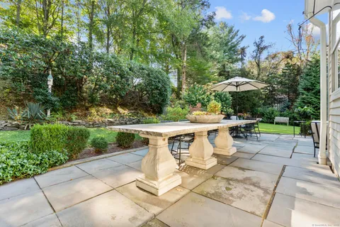 a house view with a sitting space and garden space