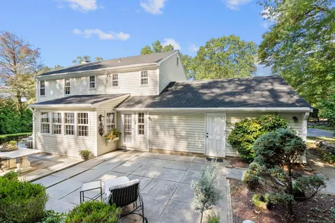 a view of house with backyard