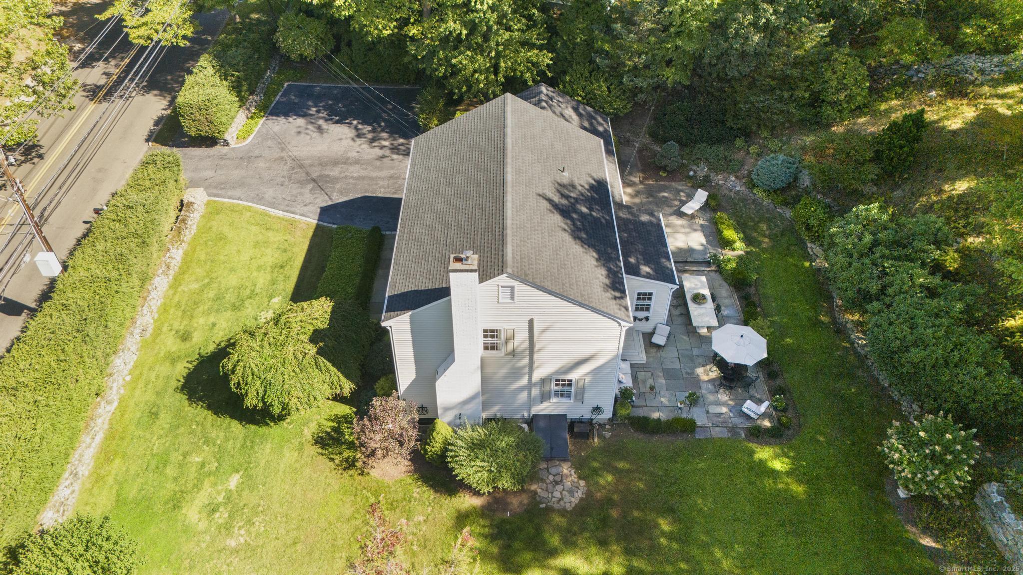 1165 Stillson Road Fairfield, CT 06824 - Photo 39 of 40 an aerial view of residential house with pool and garden