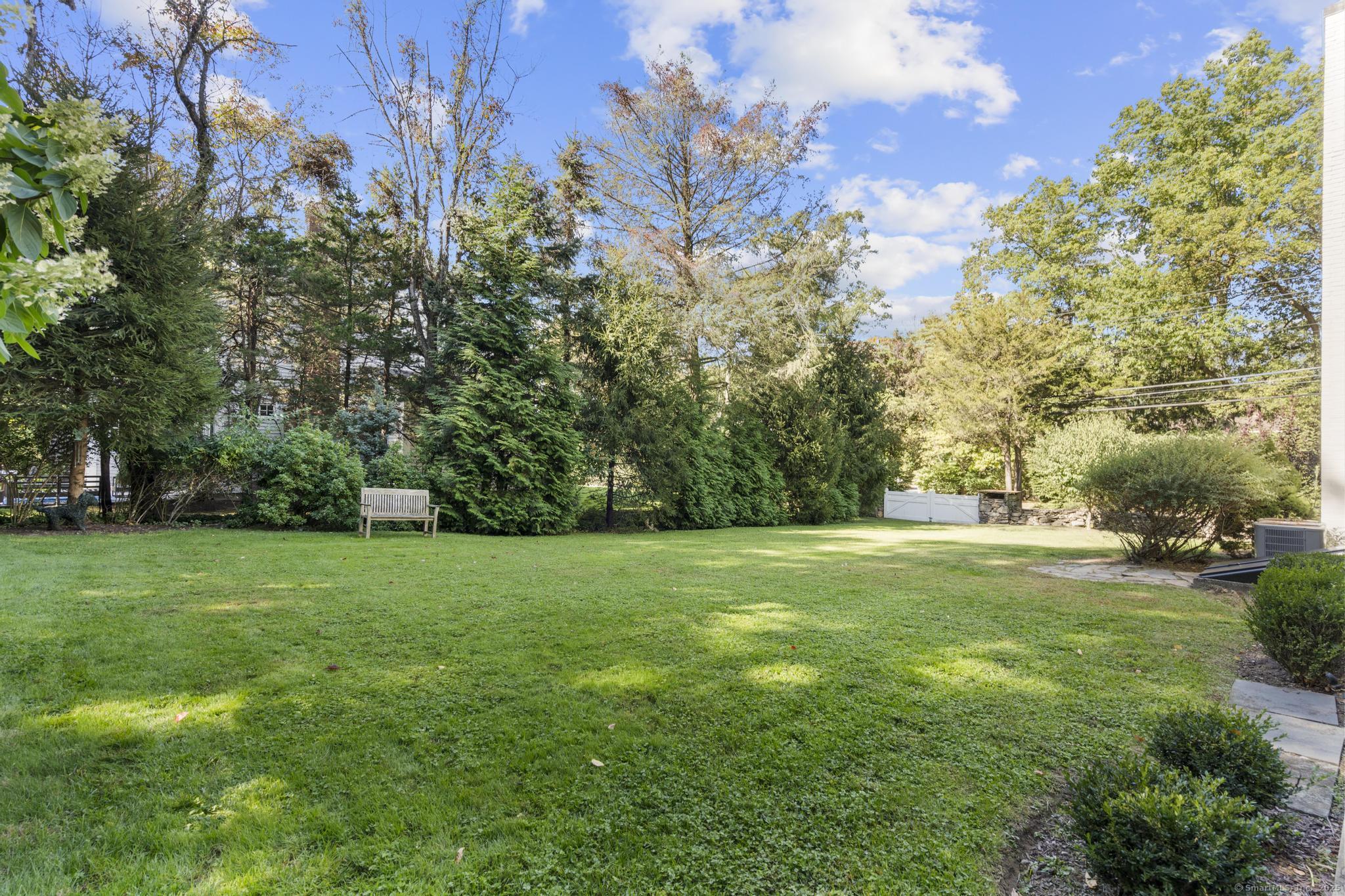 1165 Stillson Road Fairfield, CT 06824 - Photo 4 of 40 a view of a grassy field with trees