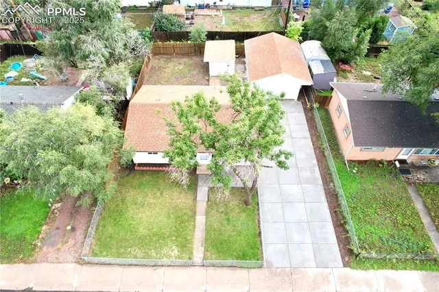 an aerial view of a house with outdoor space