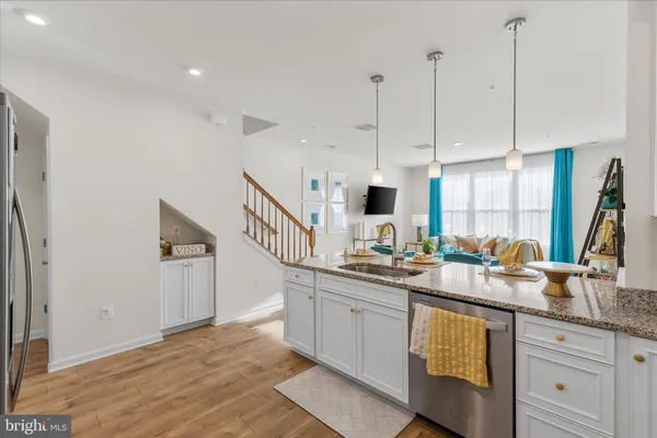 a kitchen with sink cabinets and window