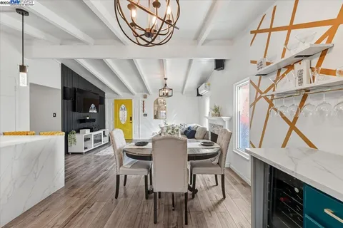 a view of a dining room with furniture window and wooden floor